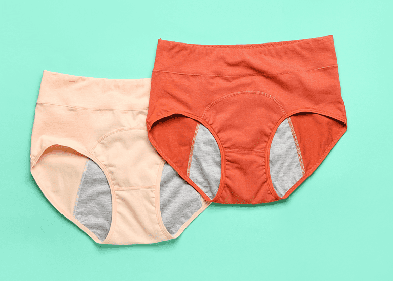two pairs of period underwear on a green background