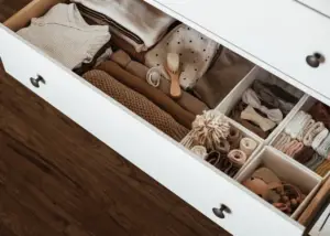 organized baby's dresser with different bins for socks, accessories, etc