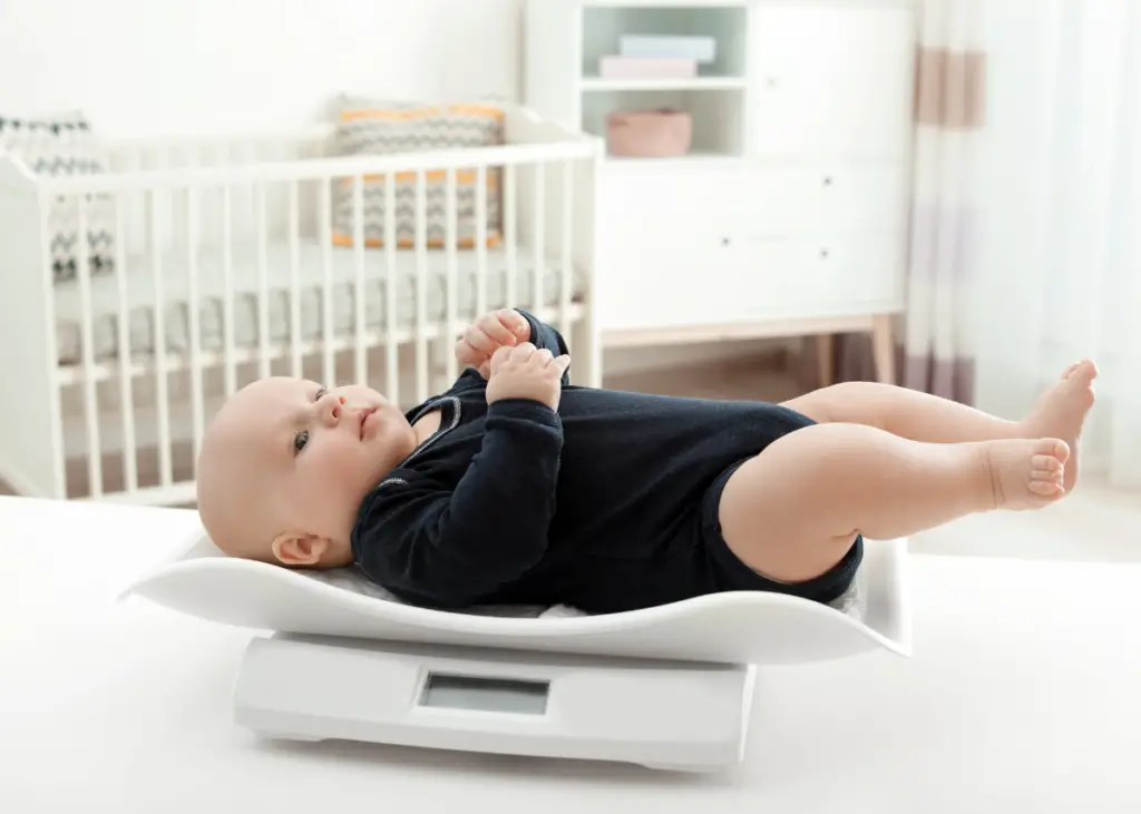 baby being weighed on baby scale