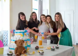 baby shower taking place in a community center with guests celebrating with mom-to-be