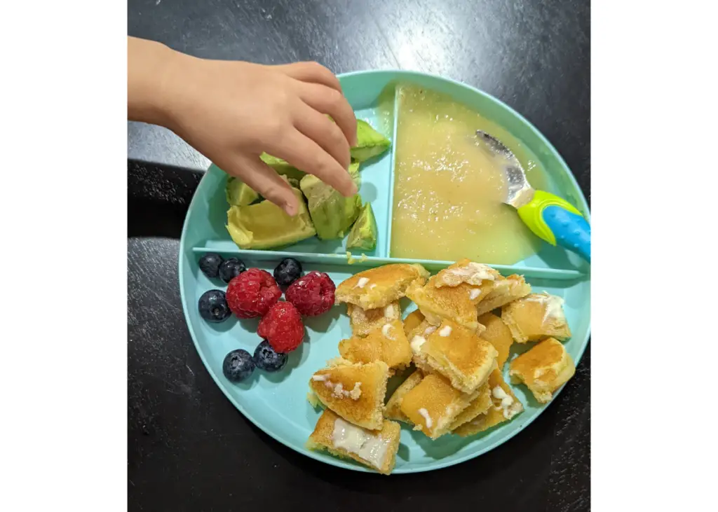 toddler meal on a divided plate for baby led weaning