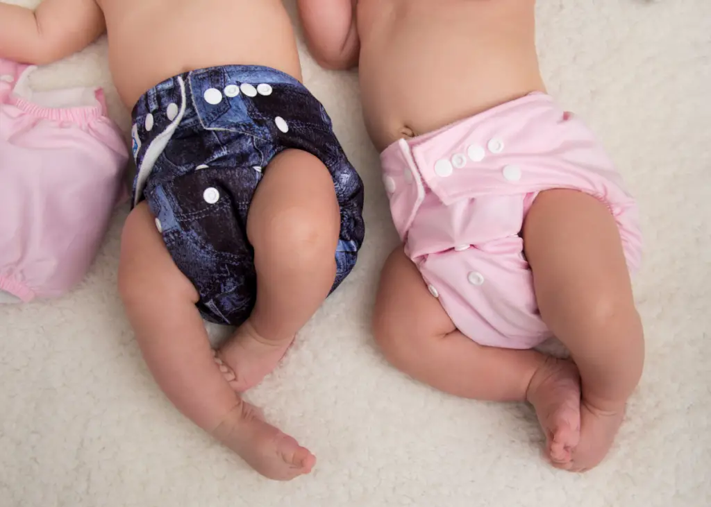 two babies sleeping in overnight cloth diapers