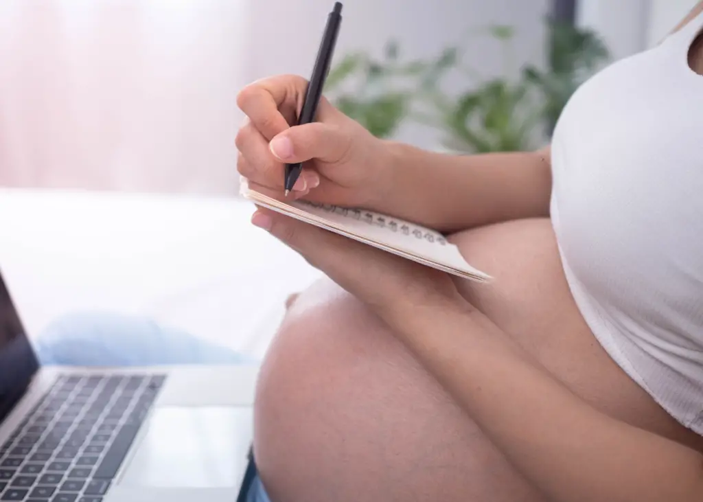 mom-to-be creating her natural birth plan in preparation for giving birth